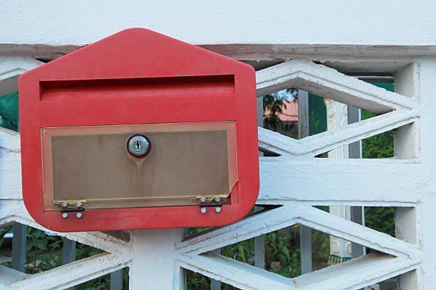 red post box in The white wall repaired by Jersey Strong mailbox locksmith NJ