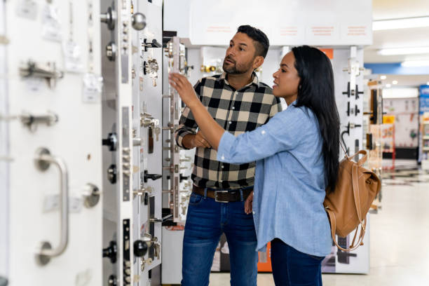 Couple looking at security locks for their house at a hardware store at Retail Locksmith NJ